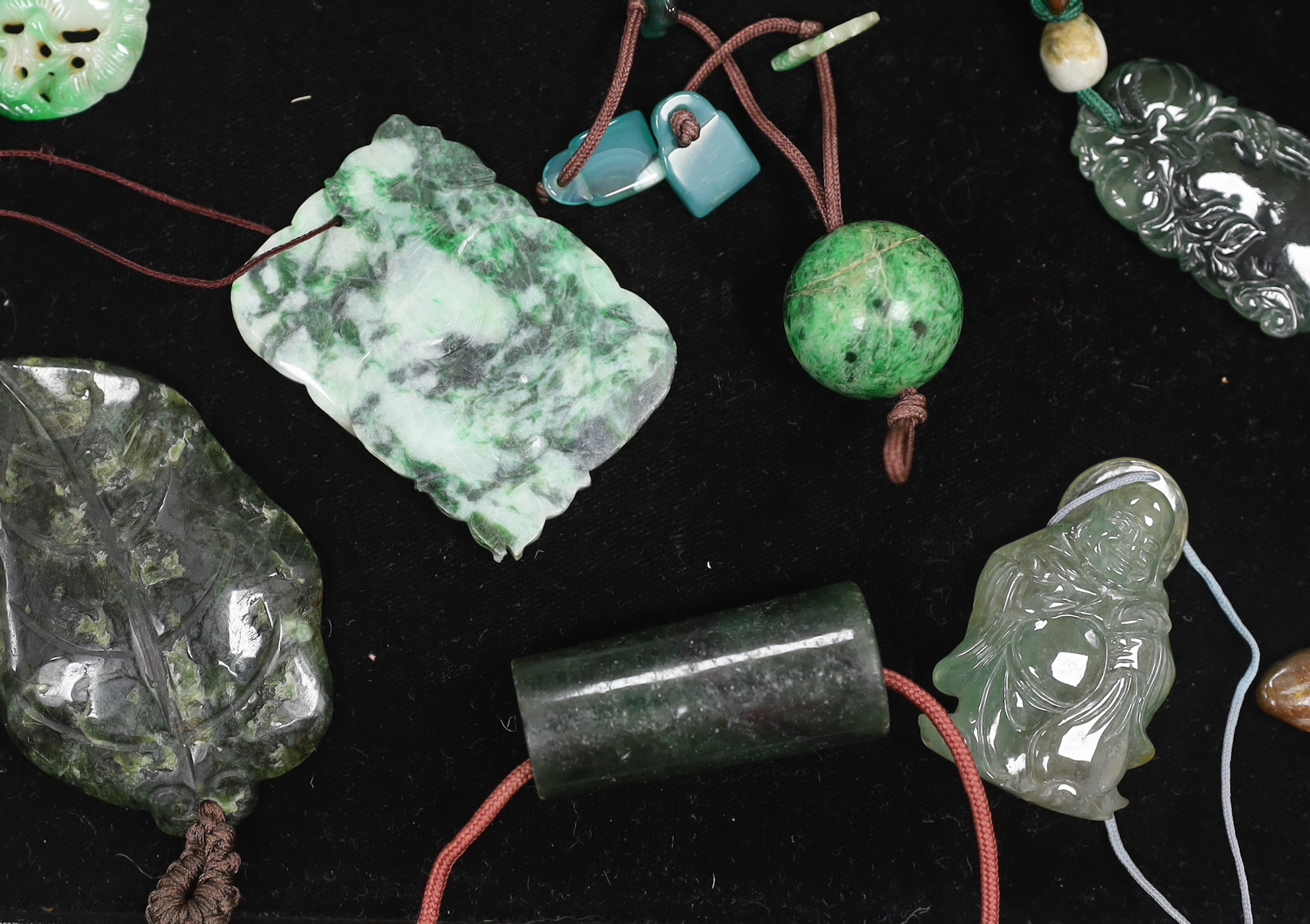 Fourteen Chinese jadeite carvings, largest 6.8cm